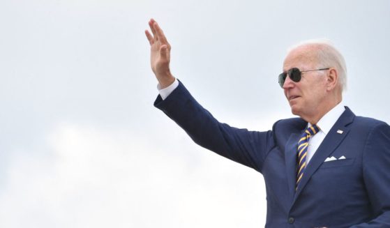 President Joe Biden waves before boarding Air Force One to depart Joint Base Andrews in Maryland on Wednesday.