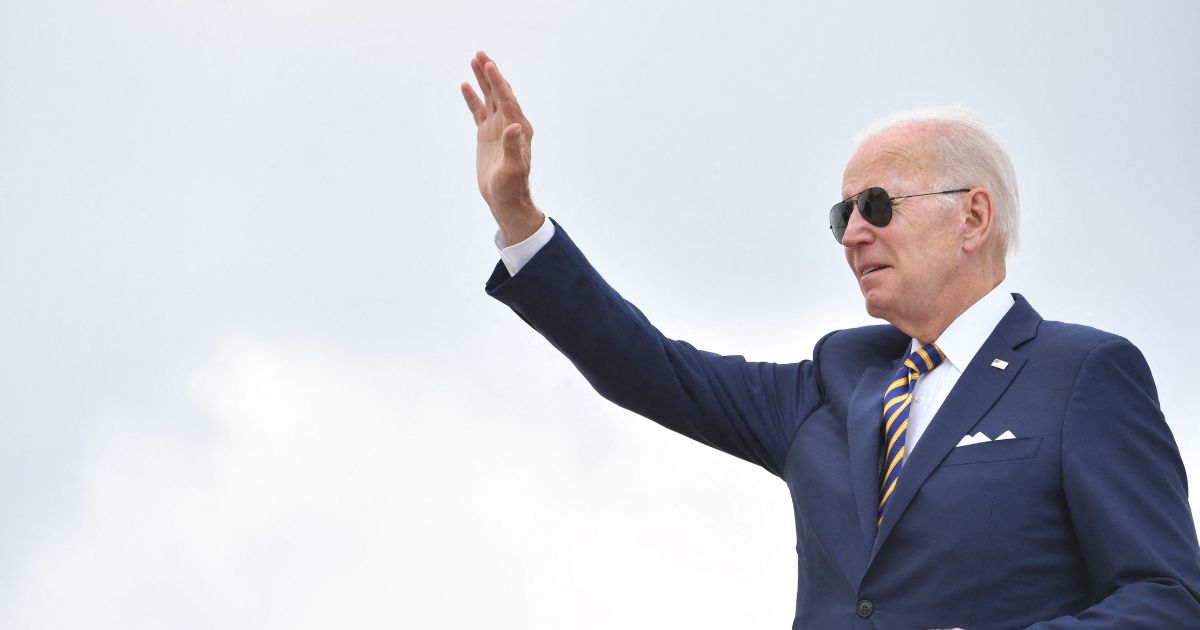 President Joe Biden waves before boarding Air Force One to depart Joint Base Andrews in Maryland on Wednesday.