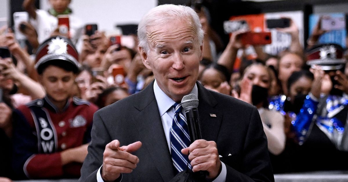 President Joe Biden speaks in the cafeteria of Richard Montgomery High School in Rockville, Maryland, before a rally for the Democratic National Committee on Thursday.