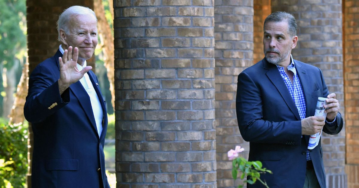 President Joe Biden waves as he and son Hunter Biden leave Holy Spirit Catholic Church in Johns Island, South Carolina, on Aug. 13.