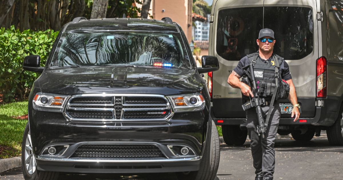 On Tuesday, a member of the secret service is seen outside of former President Donald Trump's Mar-a-Lago estate in Palm Beach, Florida, after the FBI raided the residence on Monday.