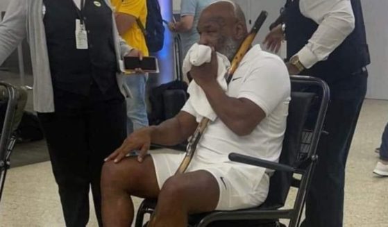 Former heavyweight boxing champion of the world Mike Tyson was seen at the Miami airport in a wheelchair with a walking stick resting in his lap on Tuesday.