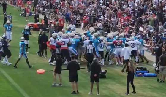 During a Tuesday scrimmage, players from the NFL's New England Patriots and North Carolina Panthers got into a brawl, which flowed into the stands, causing one fan to receive medical attention and resulting in several players from both teams being ejected.