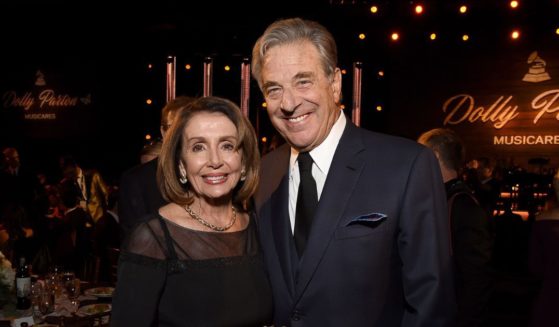 Paul Pelosi, right, and his wife, House Speaker Nancy Pelosi, attend a Los Angeles event honoring Dolly Parton in this file photo from Feburary 2019.