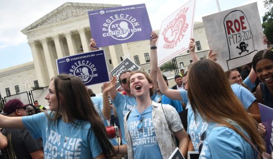 Pro-life activists celebrate the overturning of Roe v. Wade outside the U.S. Supreme Court in Washington on June 24.