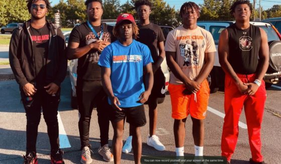 A group of high school football players and a classmate from Rome, Georgia, rescued a 50-year-old lady trapped in her vehicle following a car accident on Friday. The young men from left to right are Cesar Parker, Treyvon Adams, Antwiion Carey, Messiah Daniels, Tyson Brown and Alto Moore.