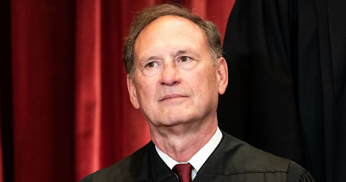 Justice Samuel Alito sits during a group photo at the Supreme Court in Washington on April 23, 2021.