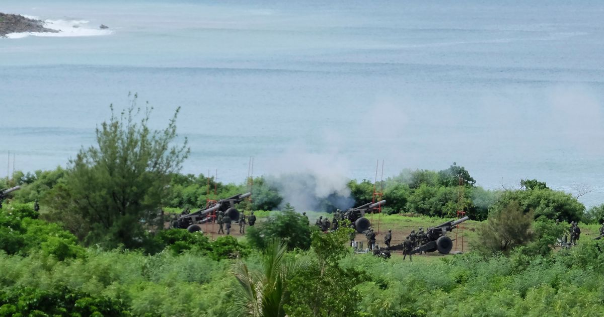 Taiwan's military performed artillery drills in response to China's military exercises in Pingtung, Taiwan, on Tuesday.