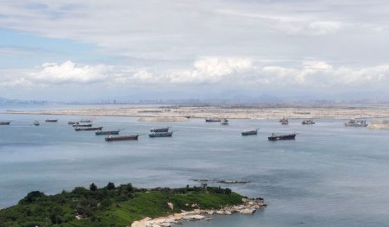 Dredge boats are expanding Chinese territory ever closer to Taiwan's Kinmen island, seen in the foreground on Wednesday.