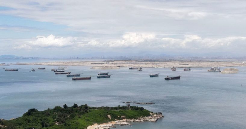 Dredge boats are expanding Chinese territory ever closer to Taiwan's Kinmen island, seen in the foreground on Wednesday.