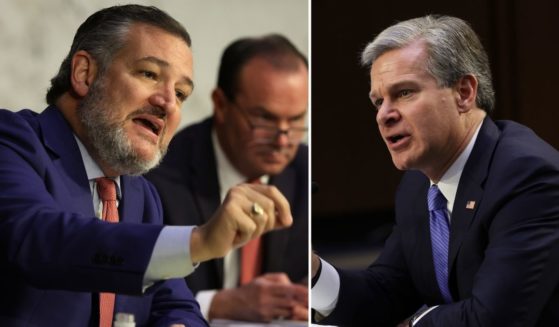 Sen. Ted Cruz, left, speaks during a hearing of the Senate Judiciary Committee on Capitol Hill on Thursday in Washington, D.C. FBI Director Christopher Wray testifies during the hearing.