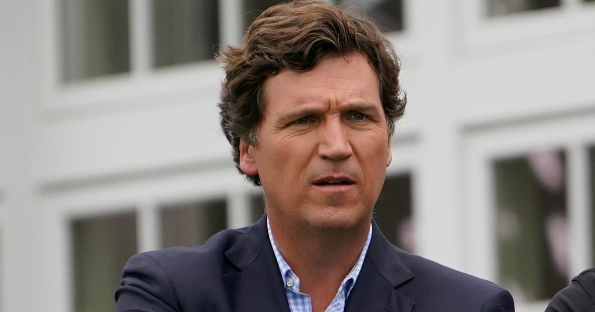 Fox News host Tucker Carlson watches the final round of the Bedminster Invitational LIV Golf tournament in Bedminster, New Jersey, on July 31.