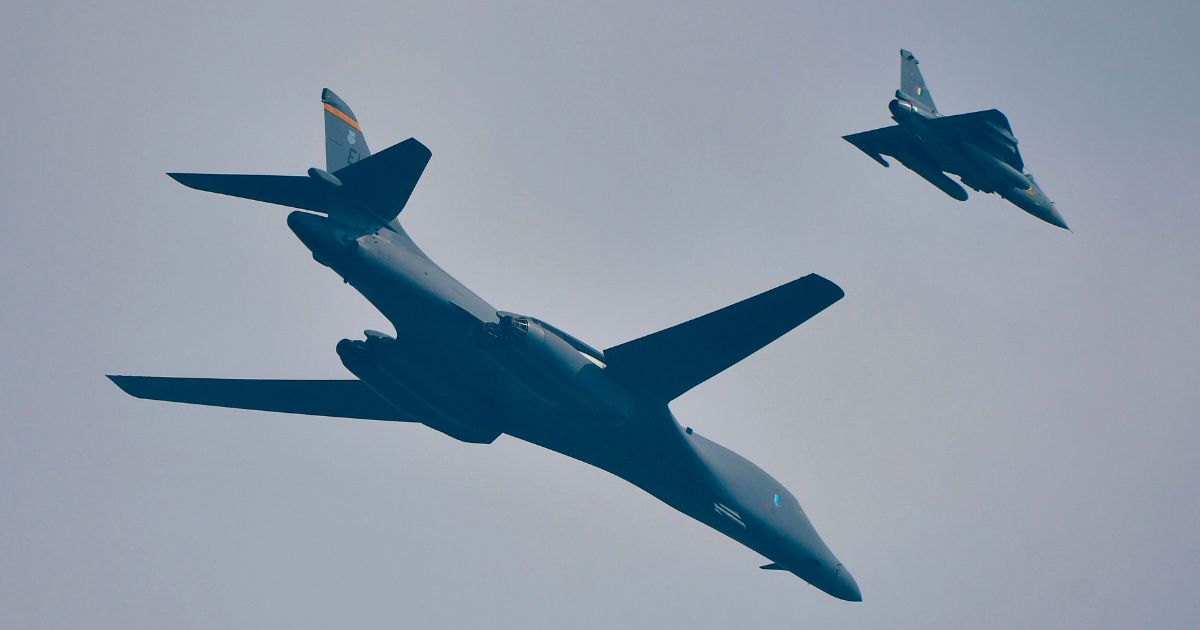 A U.S. Air Force B-1B long range heavy bomber, left, and Indian Air Force Light Combat Aircraft-Tejas, right, fly together during the Aero India 2021 Airshow at the Yelahanka Air Force Station in Bangalore on Feb. 3, 2021.