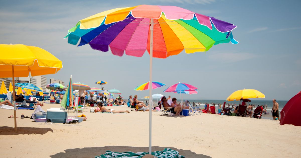 Beach umbrellas dominate the landscape in this stock photo. In South Carolina on Wednesday, a 63-year-old woman was impaled by a flying beach umbrella and died less than an hour later.