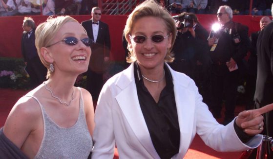 Actress Anne Heche, who died Friday, is pictured in a 1999 file photo arriving at the Oscars with then-partner Ellen DeGeneres