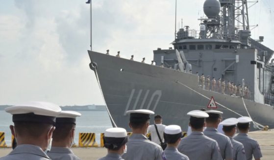 Taiwanese Navy soldiers walk in front of a frigate during a visit Tuesday by Taiwanese President Tsai Ing-wen to inspect the military on Taiwan's Penghu islands.