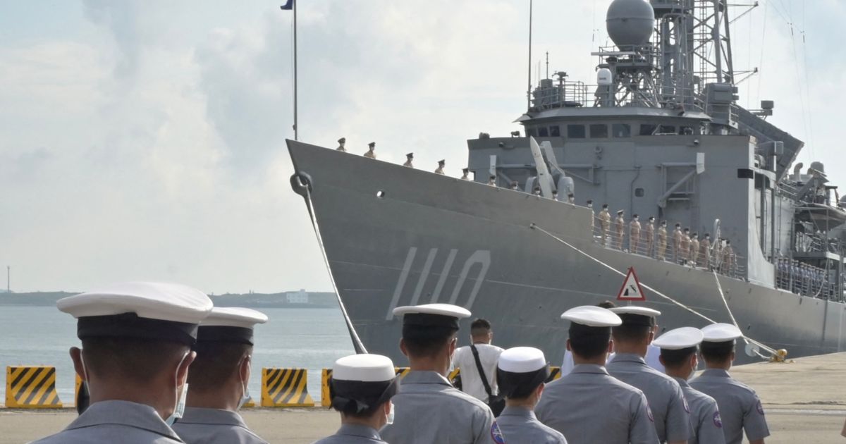 Taiwanese Navy soldiers walk in front of a frigate during a visit Tuesday by Taiwanese President Tsai Ing-wen to inspect the military on Taiwan's Penghu islands.