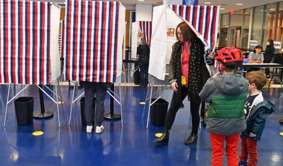 Voters enter booths to mark their ballots during an election day in New York.