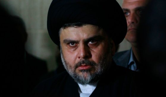 Iraqi Shiite cleric Muqtada al-Sadr looks on during a meeting to discuss economic and security issues held at Iraqi Shiite Muslim leader Ammar al-Hakim's house in the southern Shiite city of Najaf on Jan. 23, 2015.