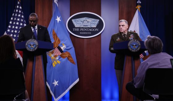 Secretary of Defense Lloyd Austin, left, and Chairman of the Joint Chiefs of Staff General Mark Milley, right, participate in a news briefing at the Pentagon on July 20 in Arlington, Virginia.
