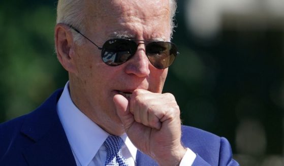 President Joe Biden coughs while speaking at an event on the South Lawn of the White House in Washington, D.C, on Tuesday.