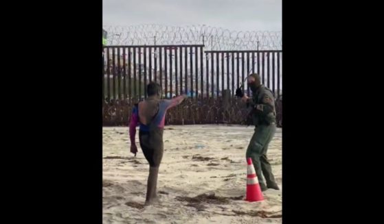 An altercation between an alleged smuggler and border patrol agents was captured on a Southern California beach.