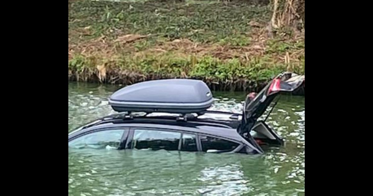 An electronic handbrake failed and sent the car into the water.