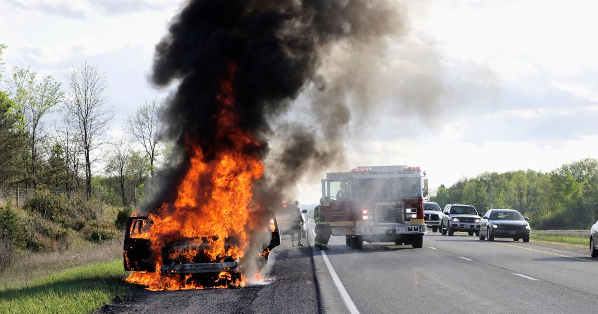 An undated stock image shows a car on fire