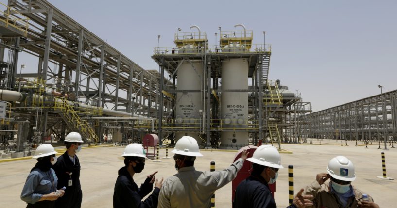 Saudi Arabian Aramco engineers and journalists look at the Hawiyah Natural Gas Liquids Recovery Plant in Hawiyah, Saudi Arabia, on June 28, 2021.
