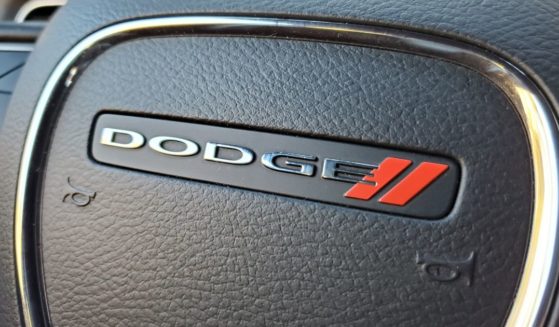 The above image is a close-up of a car steering wheel featuring the Dodge logo in Lafayette, California.