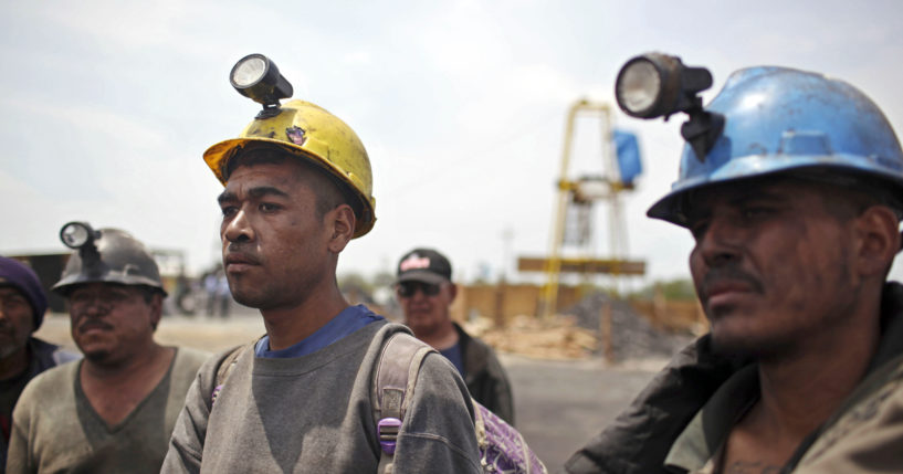 Miners helping in the rescue operation of fellow trapped miners are interviewed in San Juan de Sabinas, Coahuila state, in a May 2011 file photo.