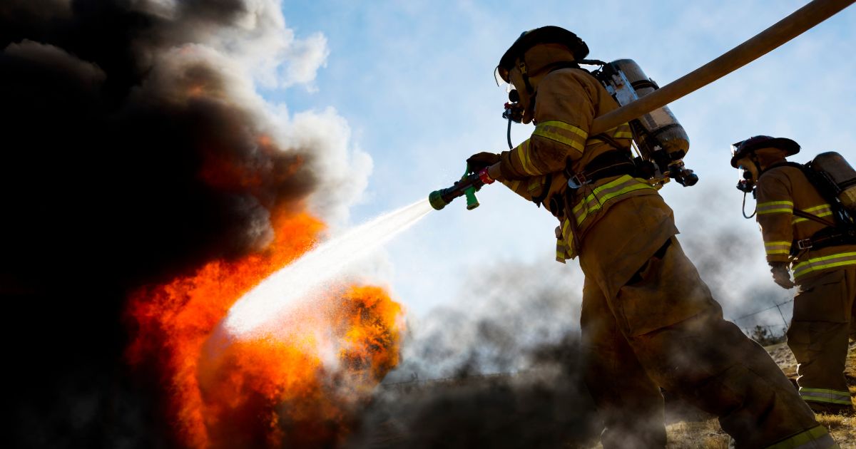 The above stock image is of firefighters extinguishing a burning house fire.