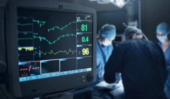 Medical data appears on a screen in a hospital in the above stock image.