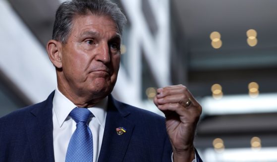 Sen. Joe Manchin, the West Virginia Democrat, talks to reporters Aug. 1 about his deal with Majority Leader Chuck Schumer to pass the so-called Inflation Reduction Act.