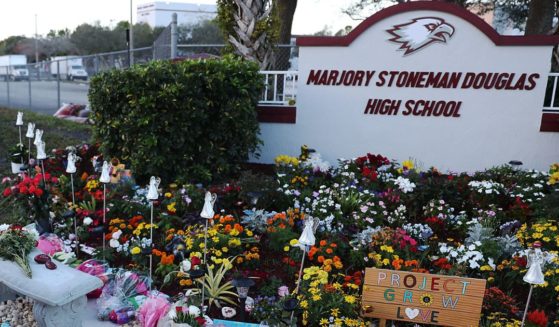 A memorial is set up outside of Marjorie Stoneman Douglas High School in Parkland, Florida, on Feb. 14, 2019, one year after a mass school shooting claimed the lives of 14 students and three staff members.