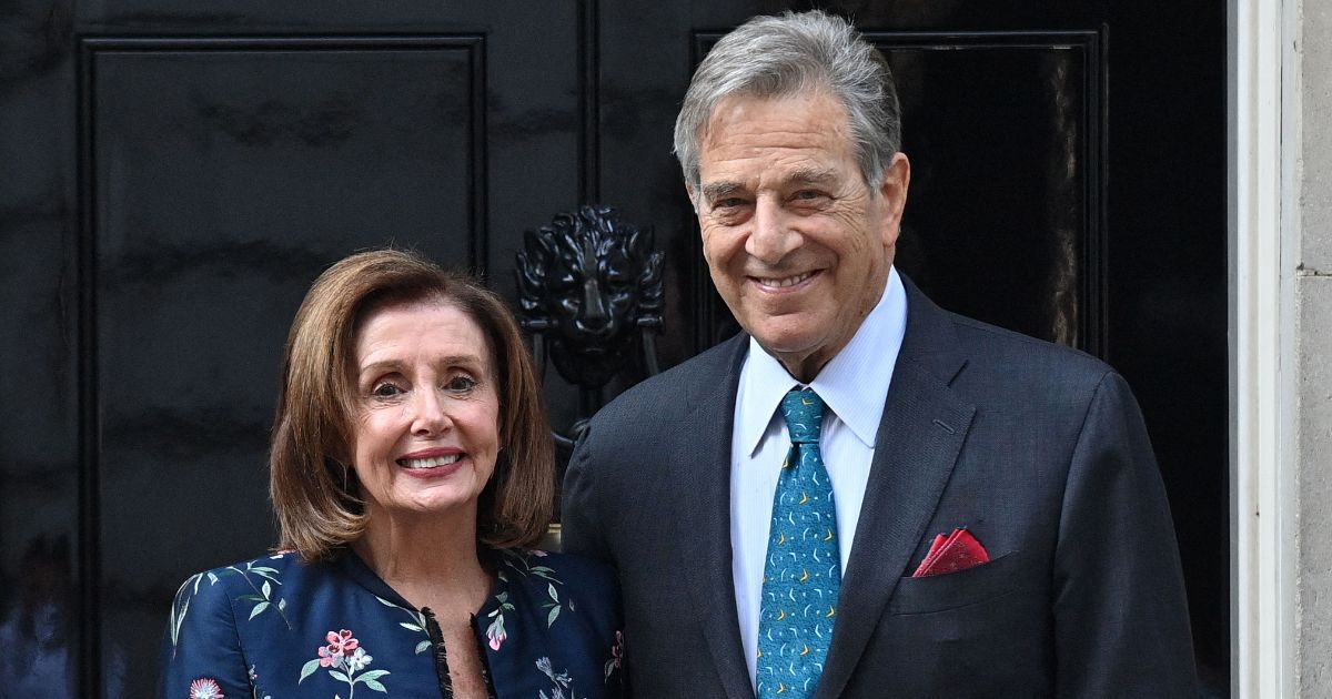 Speaker of the House Nancy Pelosi, left, and her husband Paul Pelosi pose for the media outside of 10 Downing Street in central London on Sept. 16, 2021.