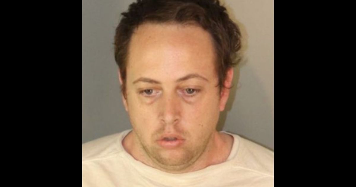 Logan Nighswonger, 32, is arrested after he allegedly ran into a girl's restroom at an elementary school.
