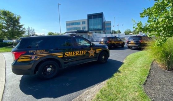 Law enforcement exchanged fire with a suspect who allegedly tried to breach an FBI building in Kenwood, Ohio, on Thursday.