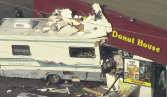 An RV crashes into a doughnut shop in Lakewood, Colorado, on Monday.