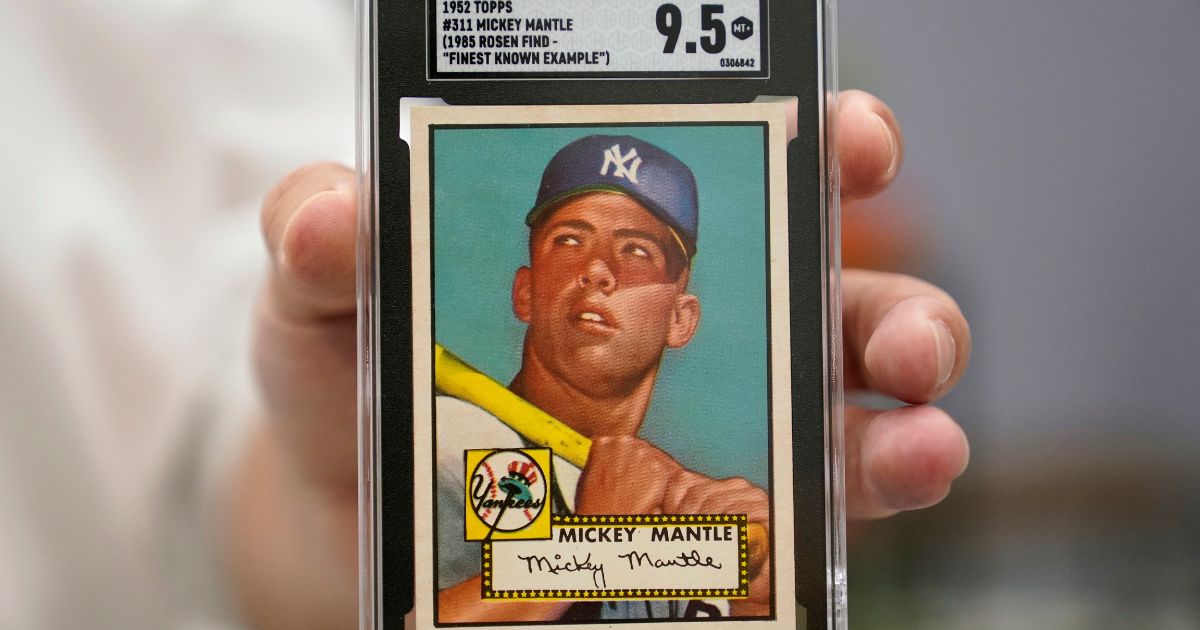 A Mickey Mantle baseball card is displayed at Heritage Auctions in Dallas, on July 21.