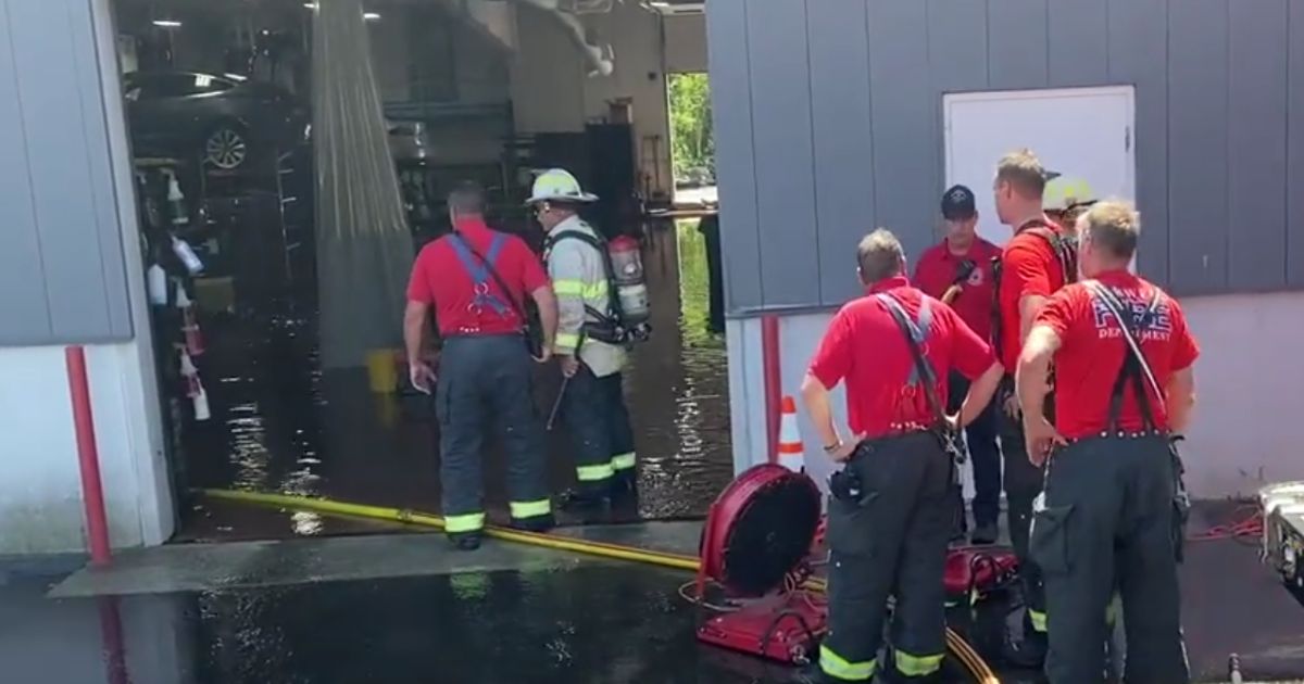 Firefighters were called to a Tesla dealership in Norwell, Massachusetts, after a fire started.