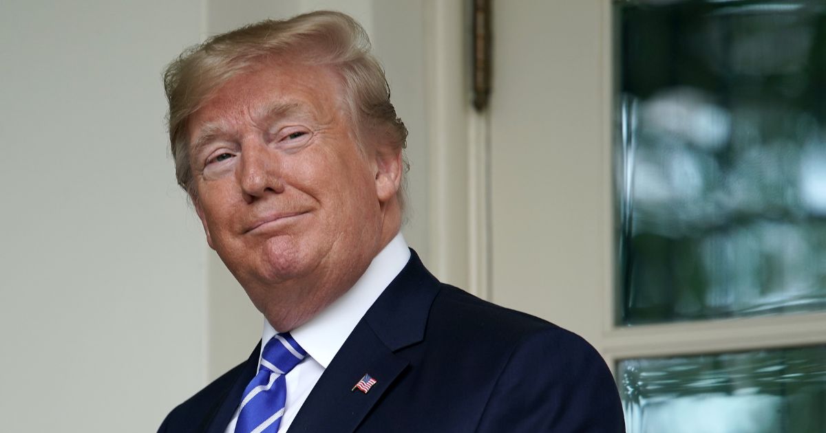 President Donald Trump looks back at journalists after welcoming Mongolian President Battulga Khaltmaa to the White House on July 31, 2019, in Washington, D.C.