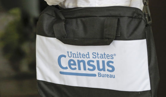 The bag of a U.S. Census Bureau census taker is pictured as he walks to a residence in Winter Park, Florida, on Aug. 11, 2020.