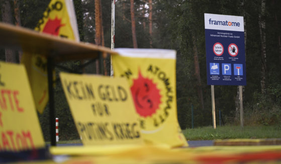 Protest posters are seen outside the fuel element fabrication plant of the Framatome company in Lingen, Germany, on Monday, after the Germany government said it would not be able to stop Russia from shipping uranium through the country and processing it at a site in Germany.