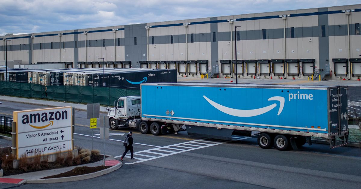 a truck arriving at an Amazon warehouse