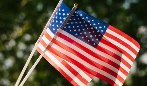Two American flags are seen in the above stock image.