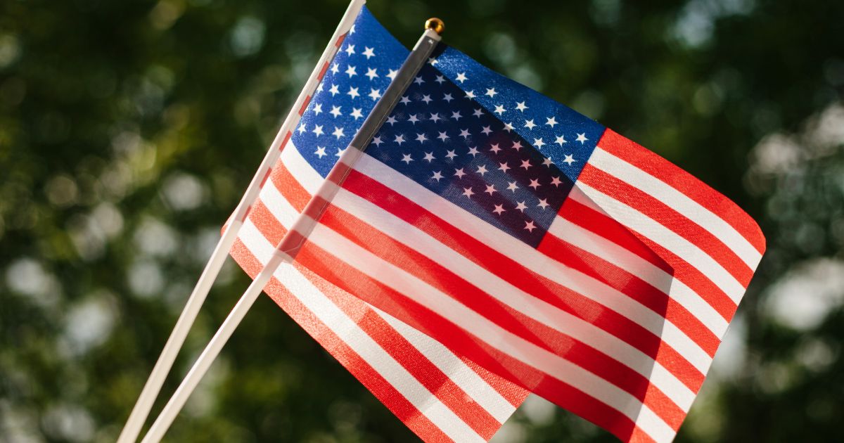 Two American flags are seen in the above stock image.