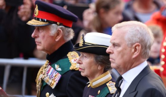 King Charles III, left, Princess Anne, middle, and Prince Andrew, right, walk behind Queen Elizabeth II's coffin in Edinburgh, Scotland, on Monday.