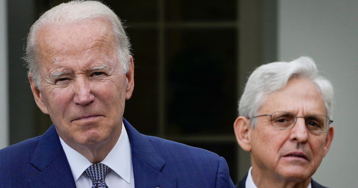 Attorney General Merrick Garland, right, looks on as President Joe Biden speaks in the Rose Garden of the White House in Washington on May 13.