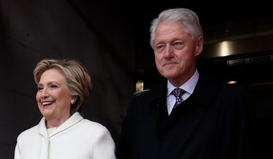 Former President Bill Clinton and former first lady Hillary Clinton are pictured arriving for the inauguration of Donald Trump on January 20, 2017, in Washington, DC.